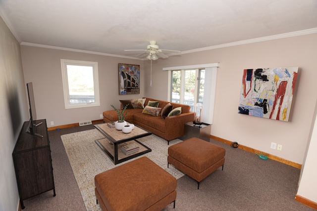 living area featuring crown molding, visible vents, baseboards, and a ceiling fan