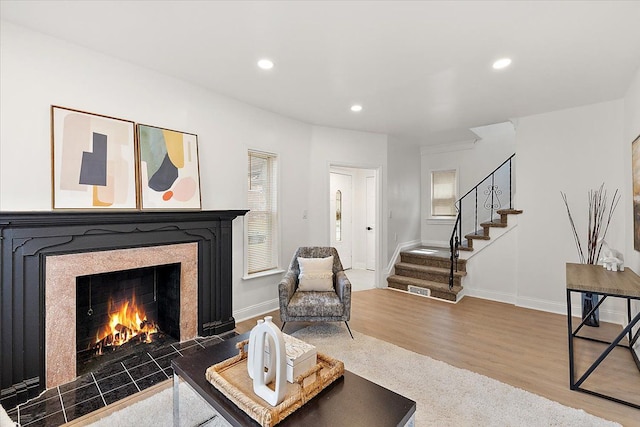 18645 Cherrylawn St, Detroit, MI 48221 - living area with baseboards, recessed lighting, a fireplace, stairs, and wood finished floors