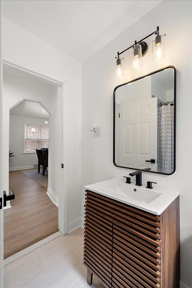 18645 Cherrylawn St, Detroit, MI 48221 - bathroom featuring baseboards, vanity, and wood finished floors