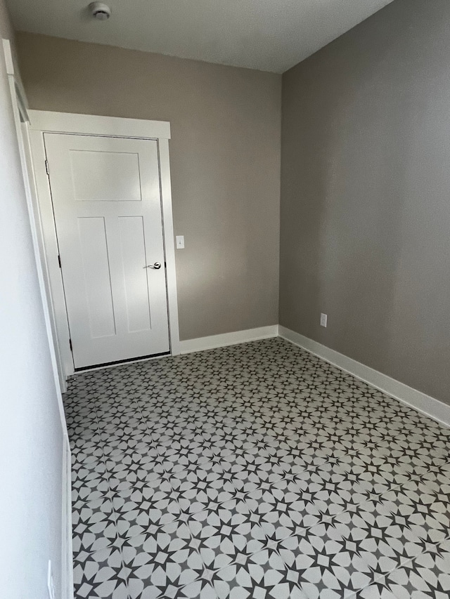 60671 Town Square St, New Hudson, MI 48165 - spare room with baseboards