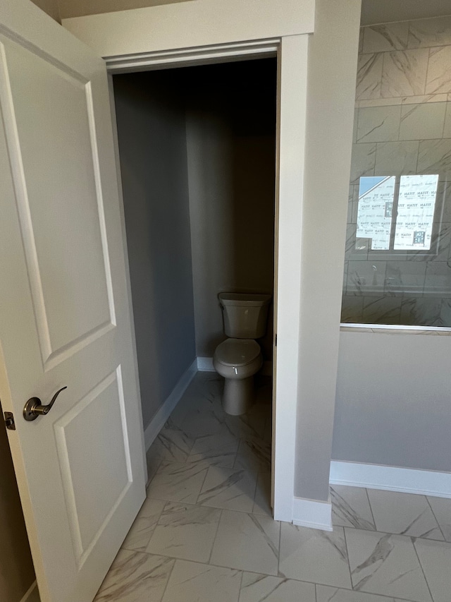 60671 Town Square St, New Hudson, MI 48165 - full bath featuring toilet, baseboards, marble finish floor, and walk in shower