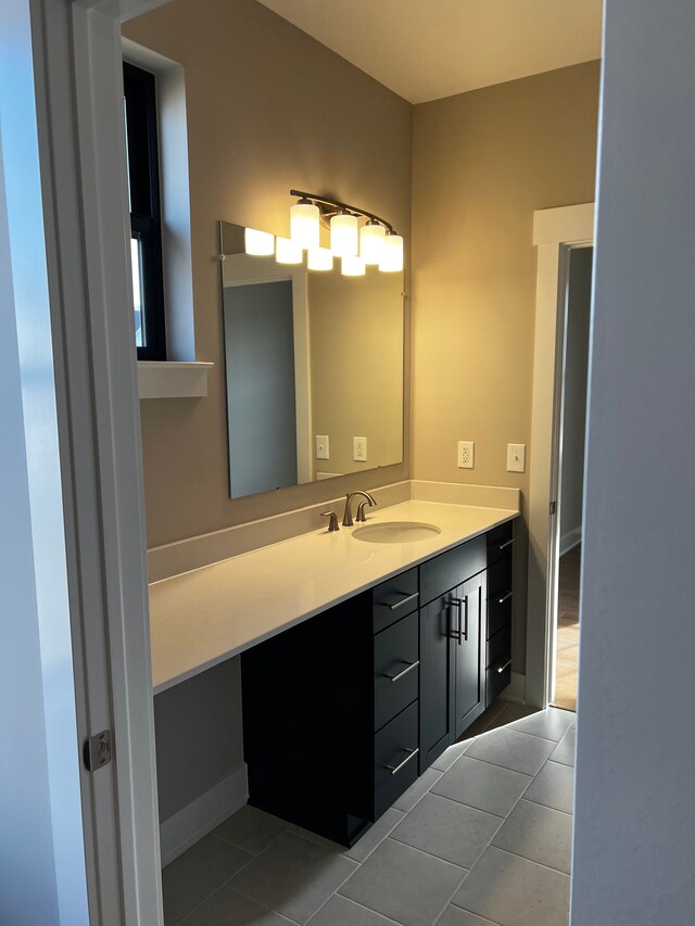 60671 Town Square St, New Hudson, MI 48165 - bathroom with tile patterned floors and vanity