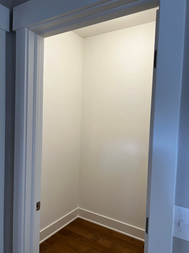 60671 Town Square St, New Hudson, MI 48165 - empty room with baseboards and dark wood finished floors