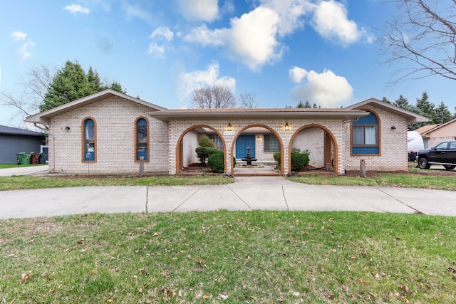 46498 Houghton Dr, Shelby, MI 48315 - ranch-style home featuring a front yard, brick siding, and driveway