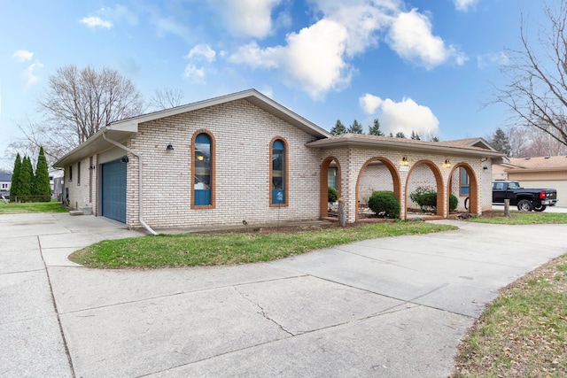 46498 Houghton Dr, Shelby, MI 48315 - single story home featuring concrete driveway, brick siding, and a garage