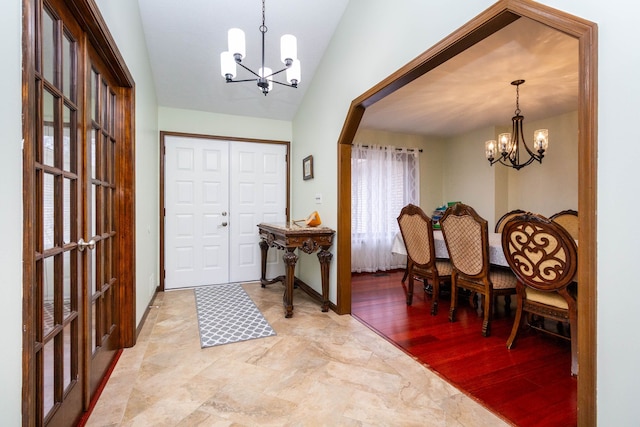 46498 Houghton Dr, Shelby, MI 48315 - entryway featuring a chandelier, light wood-style floors, and lofted ceiling