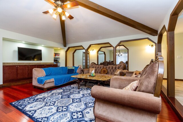 46498 Houghton Dr, Shelby, MI 48315 - living room with arched walkways, wood finished floors, ceiling fan, and vaulted ceiling with beams