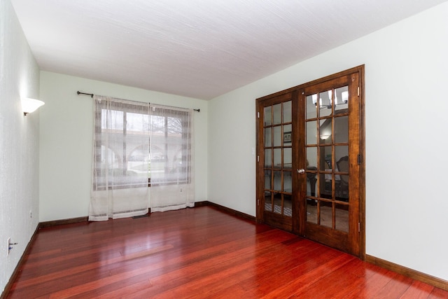 46498 Houghton Dr, Shelby, MI 48315 - spare room featuring french doors, baseboards, and wood finished floors