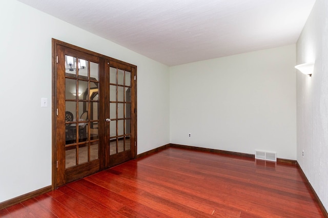 46498 Houghton Dr, Shelby, MI 48315 - unfurnished room featuring french doors, baseboards, wood finished floors, and visible vents