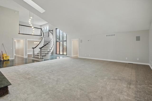 4489 Cranbrook Trl, Orchard Lake, MI 48323 - unfurnished living room with a towering ceiling, visible vents, stairway, a skylight, and carpet flooring