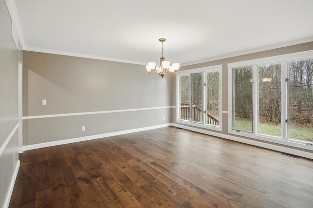 4489 Cranbrook Trl, Orchard Lake, MI 48323 - empty room with baseboards, an inviting chandelier, crown molding, and dark wood finished floors