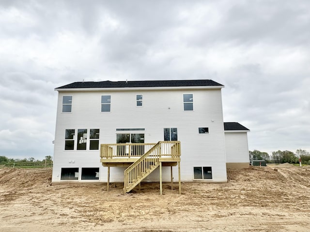 8284 Kettle Oak Dr, Alto, MI 49302 - rear view of property with a deck and stairs