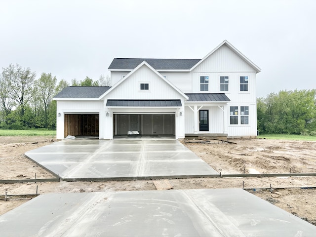 8284 Kettle Oak Dr, Alto, MI 49302 - modern farmhouse featuring a shingled roof, a standing seam roof, a garage, and metal roof