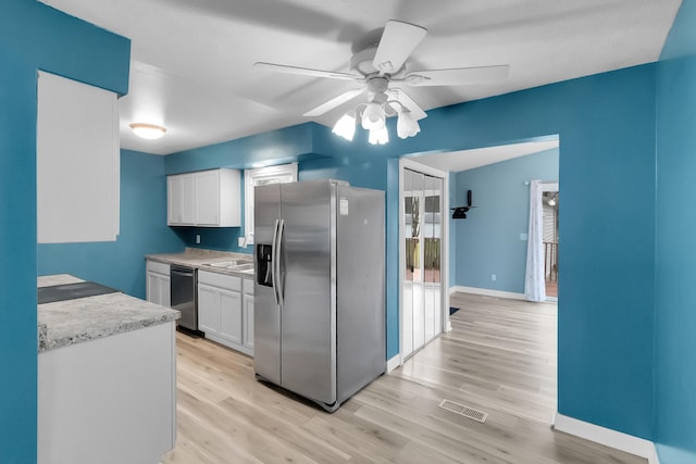 kitchen with white cabinets, visible vents, ceiling fan, and appliances with stainless steel finishes