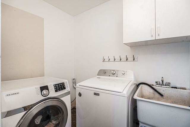 laundry room with cabinet space and independent washer and dryer