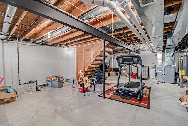 unfinished basement with heating unit and stairway