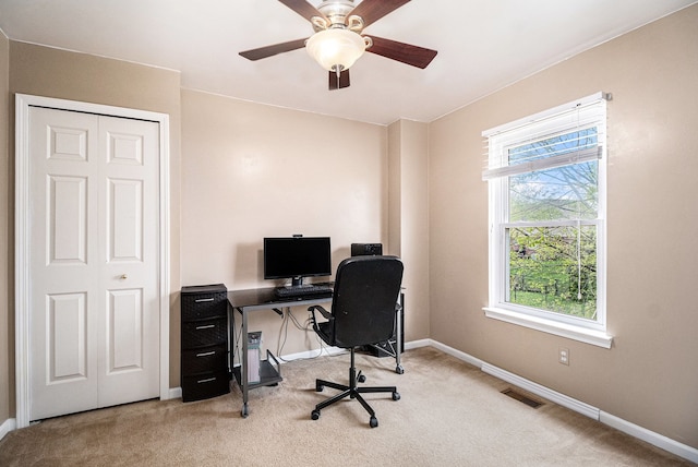 office with carpet flooring, baseboards, and ceiling fan