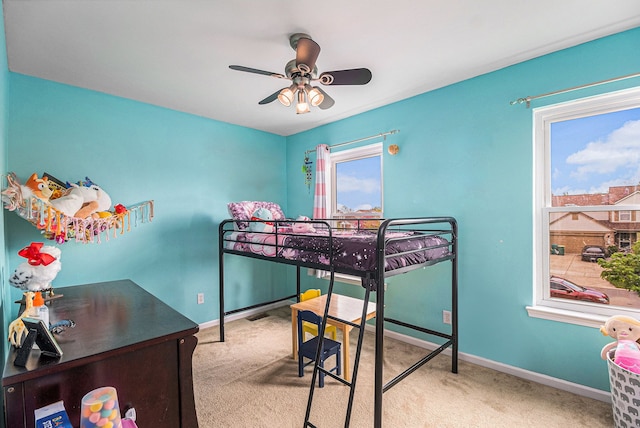 carpeted bedroom with baseboards