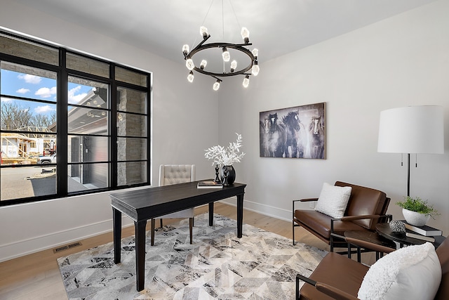 49351 Villa Dr, Novi, MI 48374 - office featuring a chandelier, baseboards, and light wood-style flooring