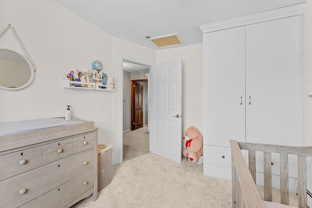 bedroom featuring light carpet and a closet