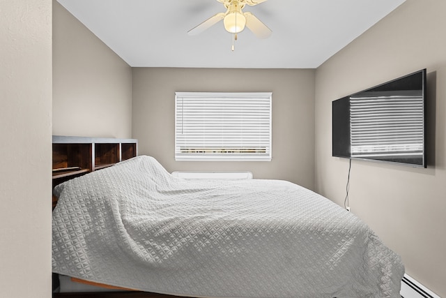bedroom featuring baseboard heating and ceiling fan