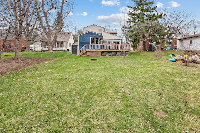 view of yard with a wooden deck and fence