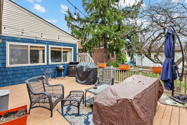 wooden deck with grilling area