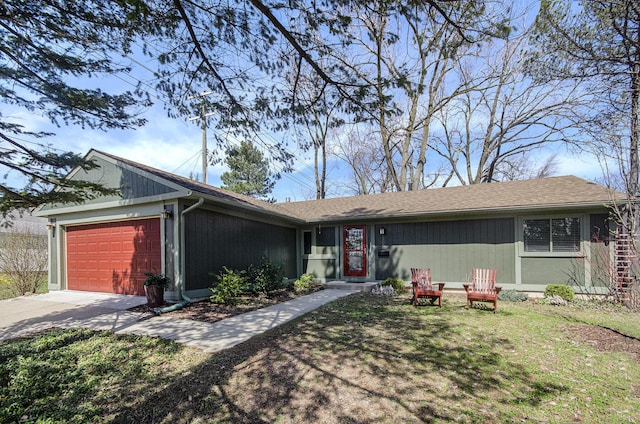 single story home featuring an attached garage and driveway