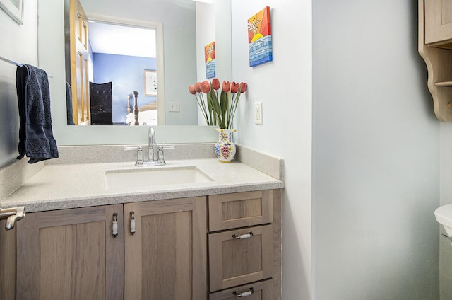 half bath featuring toilet and vanity