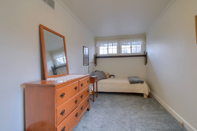 bedroom featuring baseboards, ornamental molding, visible vents, and carpet floors