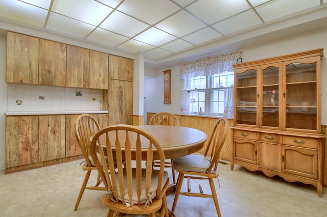 dining area with a drop ceiling