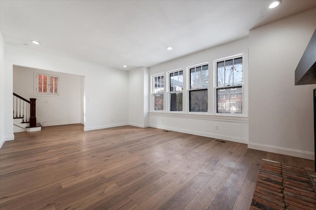1459 Edison St, Detroit, MI 48206 - unfurnished living room featuring wood finished floors, recessed lighting, baseboards, and stairs