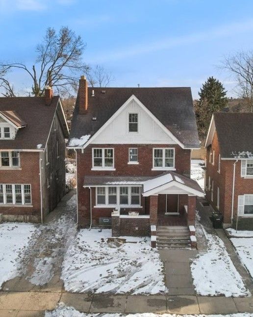 1459 Edison St, Detroit, MI 48206 - snow covered back of property with a chimney