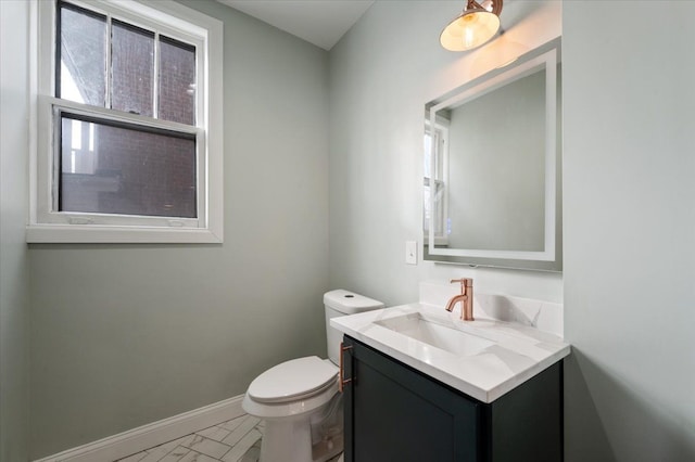 1459 Edison St, Detroit, MI 48206 - bathroom with vanity, baseboards, and toilet