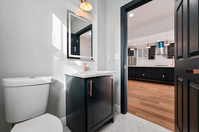 1459 Edison St, Detroit, MI 48206 - bathroom with recessed lighting, vanity, baseboards, and toilet