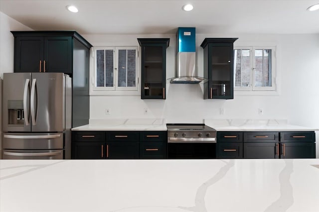 1459 Edison St, Detroit, MI 48206 - kitchen with stainless steel appliances, recessed lighting, and wall chimney exhaust hood