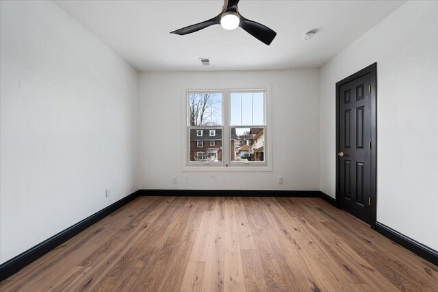 1459 Edison St, Detroit, MI 48206 - unfurnished room with ceiling fan, baseboards, and wood finished floors