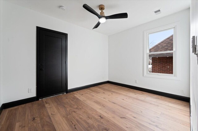 1459 Edison St, Detroit, MI 48206 - unfurnished room with visible vents, baseboards, a ceiling fan, and wood-type flooring