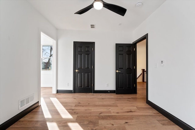 1459 Edison St, Detroit, MI 48206 - empty room with baseboards, visible vents, light wood-type flooring, and a ceiling fan
