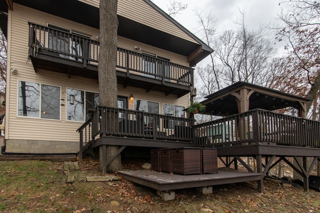 back of property with a balcony