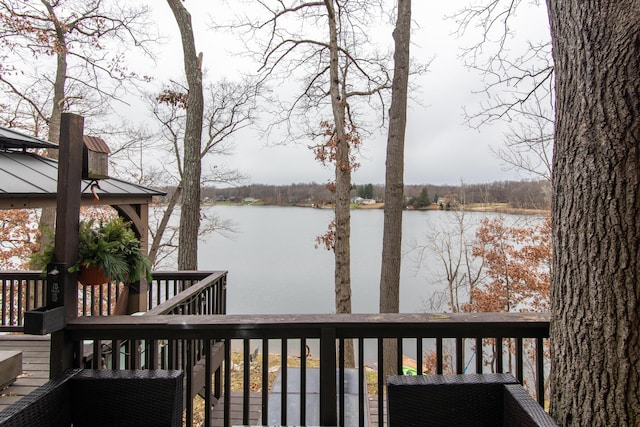 wooden deck with a water view