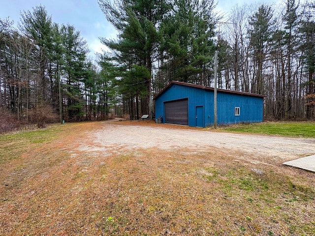 detached garage featuring driveway
