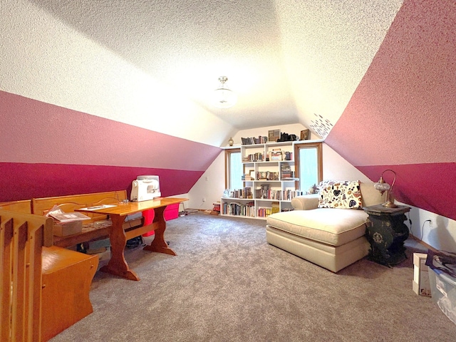 playroom with a textured ceiling, lofted ceiling, and carpet flooring
