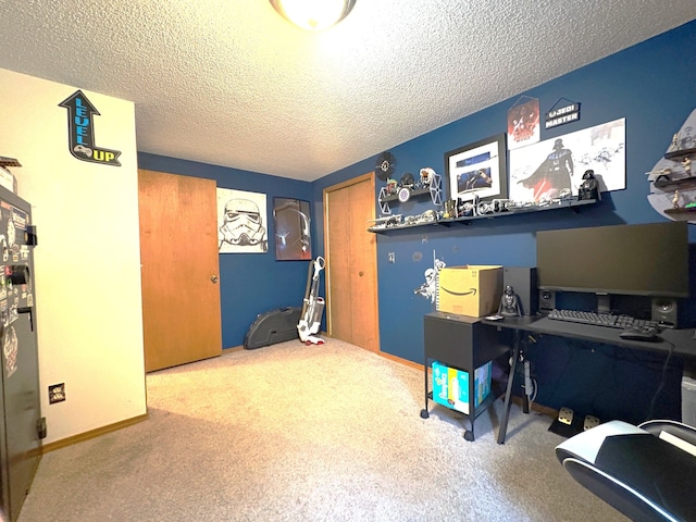 office area featuring carpet floors and a textured ceiling