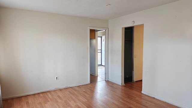3851 Wellington St, Inkster, MI 48141 - unfurnished bedroom with baseboards and light wood-type flooring