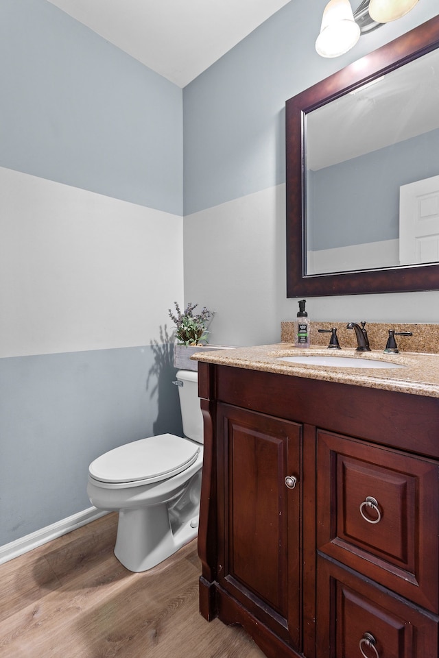 316 Lenox Ln, Brighton, MI 48114 - bathroom with vanity, baseboards, toilet, and wood finished floors