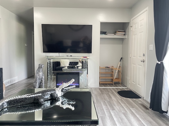 interior space featuring visible vents and wood finished floors