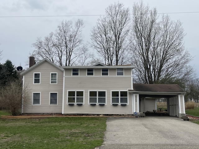 6308 E Becht Rd, Coloma, MI 49038 - traditional-style home featuring driveway, a carport, a front yard, and a chimney
