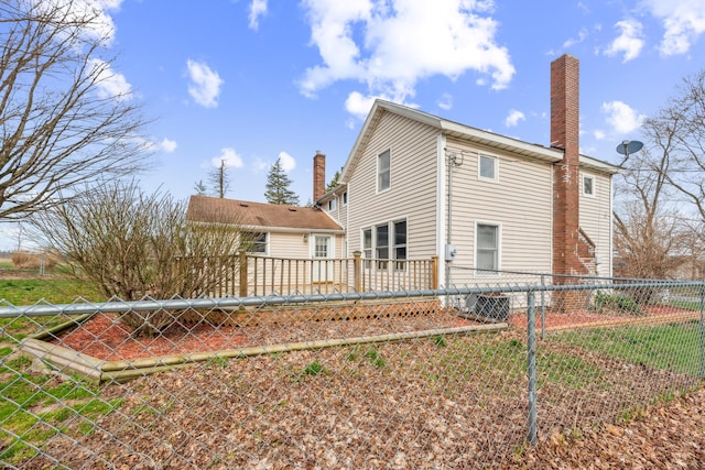 6308 E Becht Rd, Coloma, MI 49038 - back of house featuring a chimney and a wooden deck
