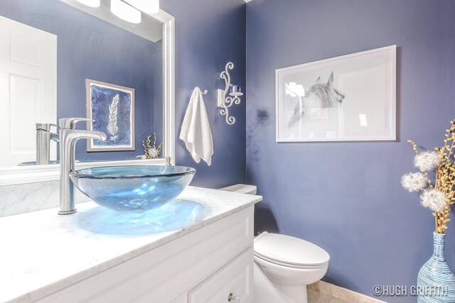 2376 Bob White Ct SE, Grand Rapids, MI 49546 - half bathroom featuring toilet and vanity